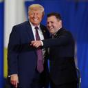 President Donald Trump and Rep. Ryan Mackenzie, R-Pa., right, appear on stage together during an event at a Mack Trucks facility, Tuesday, June 23, 2026, in Macungie, Pa.