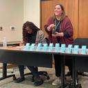 Christa Miller, Lancaster County’s election director, shakes a bottle filled with red, numbered marbles to determine the winner of tied races.