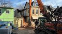 An emergency crew works to dismantle a Poplar Street home in Reading, following a partial building collapse.
