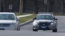 A State Police patrol car drives near Commerce Street in Carlisle, Pa.