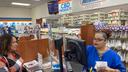 Customer Lisa Durs is helped by pharmacy clerk Kira Tomoney at Minnich's Pharmacy in York County.