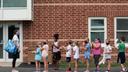 Students line up after recess for their third grade teacher Ms. Melissa Russo, far left, at Lower Gwynedd Elementary School in Ambler, PA, Thursday, September 3, 2020. The school's outdoor policy is that masks are worn outdoors if the person is within 6 feet of another person outdoors. Masks are required at all times indoors. JESSICA GRIFFIN  / Staff Photographer