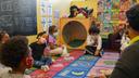 Tanisha Baylor (right) during “circle time” with the 4-year-old students under her care at The Willow School. The Montgomery County center for children has been significantly impacted by staffing shortages.