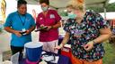 Luis Angel Guzman, a 19-year-old carnival ride worker from Mexico, talks with Wayne Memorial Community Health Center nurses at the Wayne County Fair before he got the Johnson & Johnson vaccine.