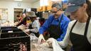 Volunteers prepare meals to deliver to older adults in Montgomery County in 2019.