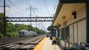 A man sits on a SEPTA platform.