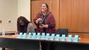 Christa Miller, Lancaster County’s election director, shakes a bottle filled with red, numbered marbles to determine the winner of tied races.