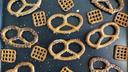 Pretzels laid out on a baking sheet