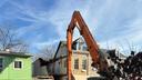 An emergency crew works to dismantle a Poplar Street home in Reading, following a partial building collapse.