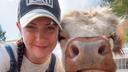 April Crossley with pet Highland cow