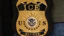 A federal agent wears an Immigration and Customs Enforcement badge in New York, June 10, 2025.