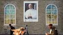 Students walk past an image of Pope Leo XIV at Villanova University in Villanova, Pa., Wednesday, Oct. 21, 2026.