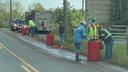A crew cleans slaughterhouse waste that spilled along a rural road in central Pennsylvania in 2021.