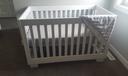A crib in a room.