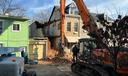 An emergency crew works to dismantle a Poplar Street home in Reading, following a partial building collapse.