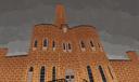An illustration of Blair County Prison with gray clouds in the background.