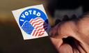 A voter holds an “I Voted” sticker Nov. 8, 2022, at Memorial Hall in Jim Thorpe Carbon County, Pennsylvania.