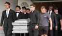 Pallbearers carry a casket containing the remains of Glenwood "Bubba" Pysher IV, who was killed by police in Pottstown, PA.