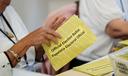 Workers sort mail ballots on primary Election Day 2024 at Northampton County Courthouse in Easton, Pennsylvania.