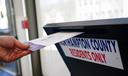 A voter puts a ballot into a drop box on primary Election Day 2024 at Bethlehem City Hall in Northampton County, PA.