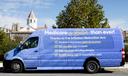 A van advertising changes to Medicare created by the Inflation Reduction Act sits outside the Heinz-Menaker Senior Ctr.