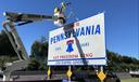 A Pennsylvania highway sign with new branding matching that of the commonwealth's new contested license plate.