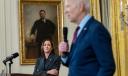 Vice President Kamala Harris looks on as President Joe Biden delivers remarks in the East Room of the White House.