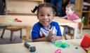 A child sits at a table at an early learning center in Pittsburgh.