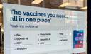 A flyer advertising vaccine services outside a CVS in Downtown Pittsburgh.