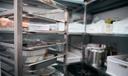 A stock image of a walk-in fridge in a restaurant.