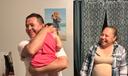 Erasmo Zavala hugs his granddaughter, Selene, as his wife Maria stands nearby. A picture of Selene’s mother, Selena, who was murdered, hangs behind the family. May 29, 2026.