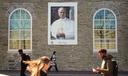 Students walk past an image of Pope Leo XIV at Villanova University in Villanova, Pa., Wednesday, Oct. 21, 2026.
