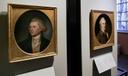 Portraits of a red-headed Thomas Jefferson, left, and John Dickinson, right, by Charles Willson Peale are seen at the refurbished Second Bank of the United States in Philadelphia.