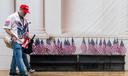 A man and woman in "Trump" hats walk through the Great American State Fair on the National Mall, in Washington.