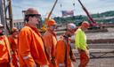 U.S. Steel employees walk to greet company and government officials at the announcement of up to $2.5 billion in investment into upgrades at the Mon Valley Works on Monday, June 8, 2026, at Edgar Thomson Plant in Braddock.