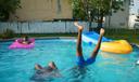 Quadrice Quarles, back left, 11 years old, Kayla Melvin, front left, 9 years old, and .Quadir Staton, front right, 10 years old,.Swim in a pool, in North Philadelphia, July 16, 2019.