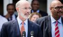 Gov. Tom Wolf (left) signed an order that directed the Department of Corrections, led by Secretary John Wetzel (right), to create a reprieve program for medically vulnerable inmates convicted of nonviolent crimes.