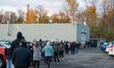 Voters stand in line at Belle Valley Fire Department in Erie County waiting to vote in person on Nov. 3, 2020.