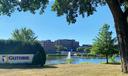 A health system campus framed by trees with a sign that says “Guthrie.”