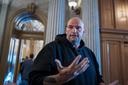 U.S. Sen. John Fetterman (D., Pa.) talks to reporters outside the chamber at the Capitol in Washington, March 13, 2025.