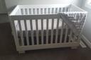 A crib in a room.