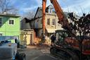 An emergency crew works to dismantle a Poplar Street home in Reading, following a partial building collapse.