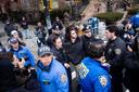 Police detain Emir Balat outside Gracie Mansion, Saturday, March 7, 2026, in New York.