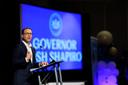 Gov. Josh Shapiro speaks behind a podium.
