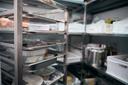 A stock image of a walk-in fridge in a restaurant.