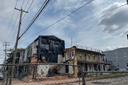 The three-story apartment complex at 501 North 8th St. in Reading remained fenced off July 18 after the south wall collapsed.