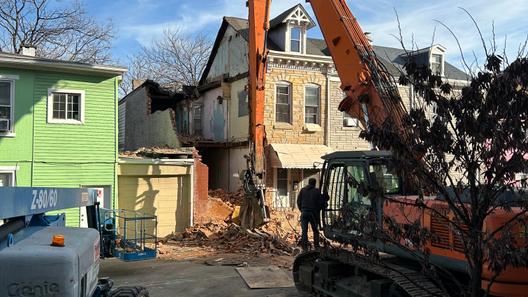 An emergency crew works to dismantle a Poplar Street home in Reading, following a partial building collapse.