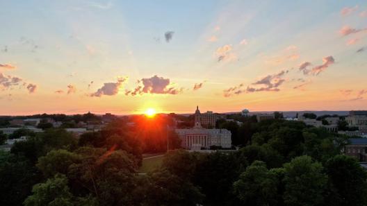 The sun over Old Main on Penn State’s University Park campus