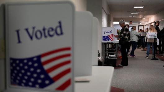 People fill out mail ballots for the 2024 election in West Chester, Pa.