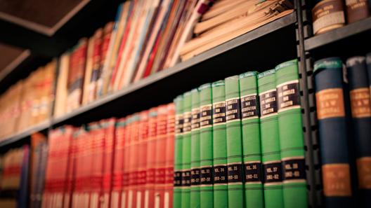 Library books arranged on a shelf Library books arranged on a shelf